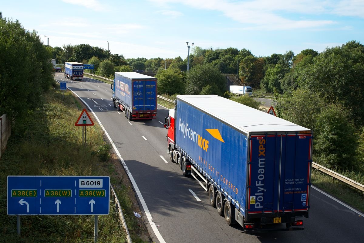 Freight trucks transporting loads on the highway